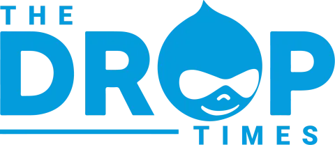 The Drop Times logo in blue featuring a stylized Drupal drop mascot and bold text.