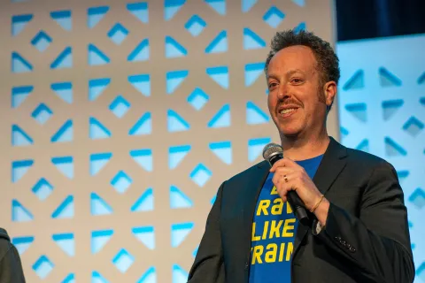 Avi Schwab, on stage at DrupalCon Chicago