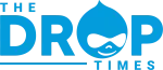 The Drop Times logo in blue featuring a stylized Drupal drop mascot and bold text.